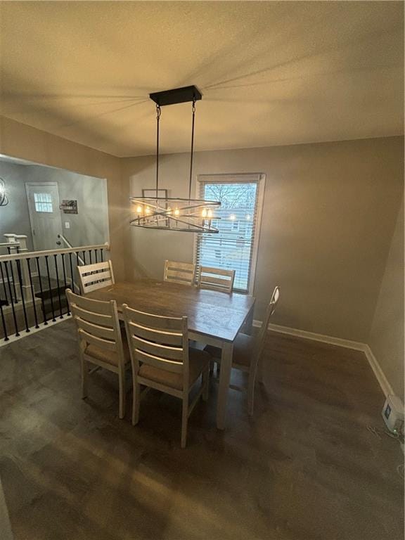 dining area with an inviting chandelier