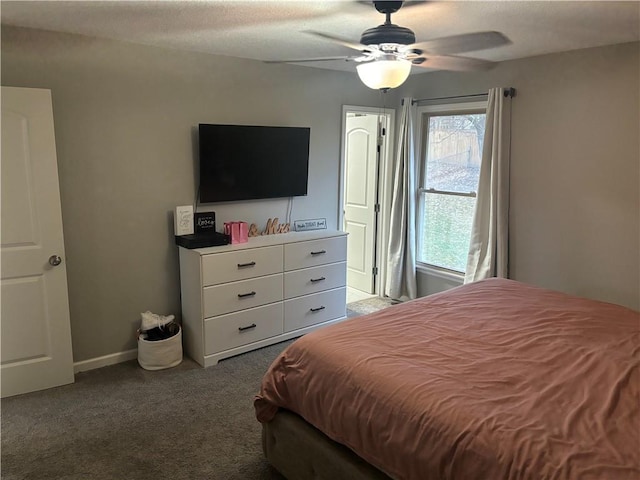 bedroom with ceiling fan and carpet floors