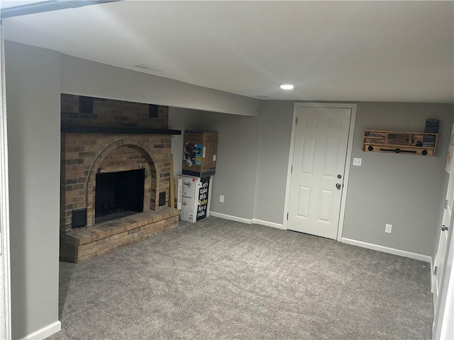 unfurnished living room with a fireplace and carpet floors