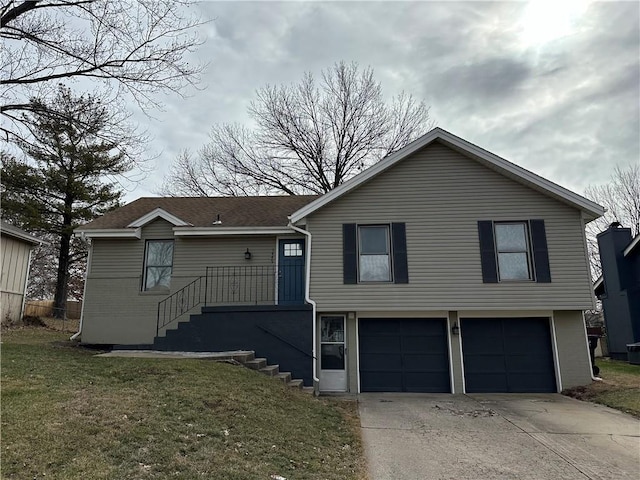 view of front of house with a garage and a front yard