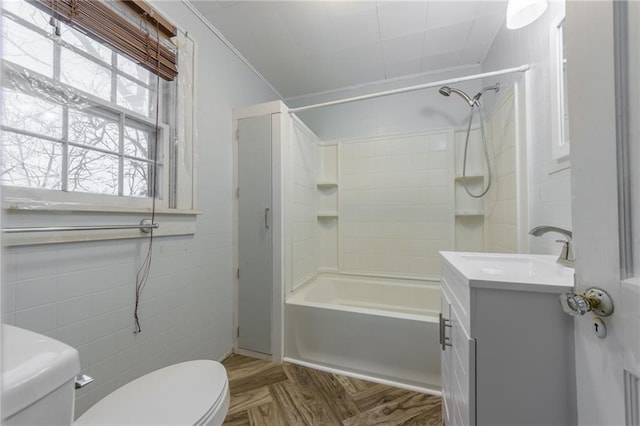 full bathroom featuring parquet flooring, ornamental molding, vanity, shower / washtub combination, and toilet