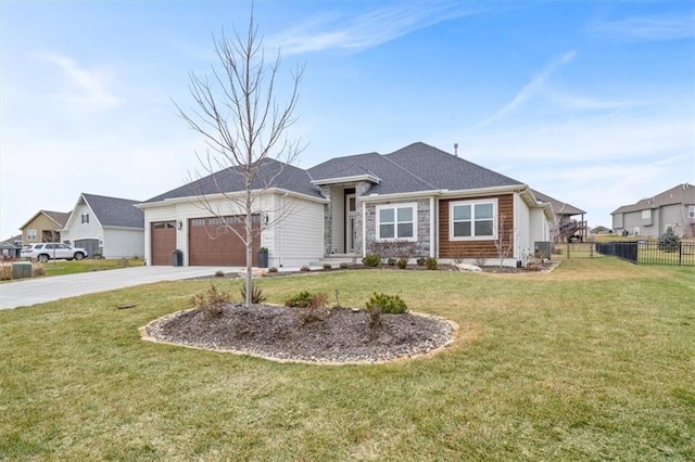 view of front of property featuring a garage and a front lawn