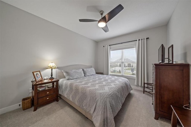 bedroom with light colored carpet and ceiling fan