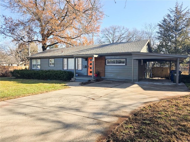 ranch-style home with a front lawn and a carport