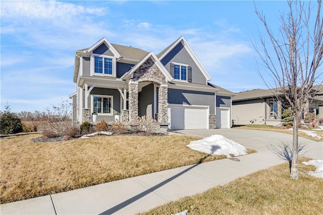 craftsman-style home with a garage and a front lawn