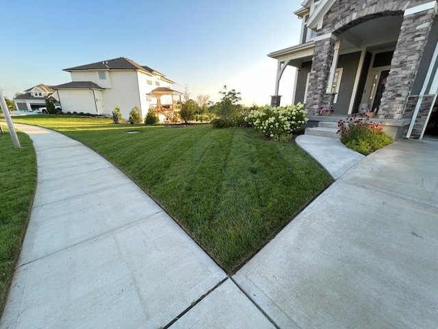 view of yard with covered porch