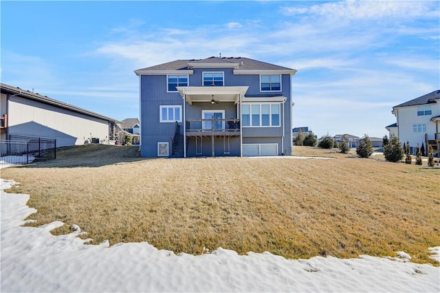 back of house featuring a lawn