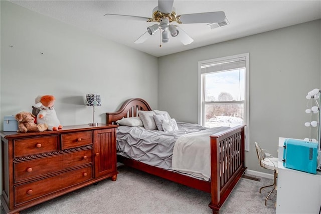 bedroom with ceiling fan and light colored carpet