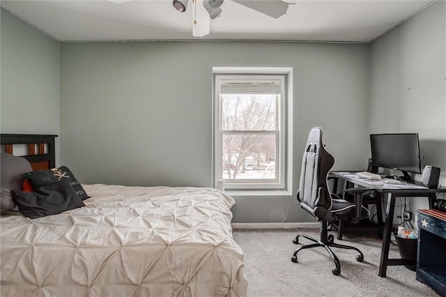 bedroom featuring light colored carpet and ceiling fan