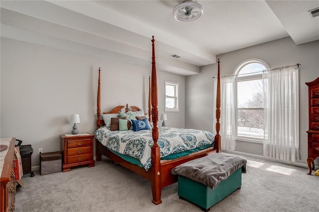 bedroom featuring light carpet