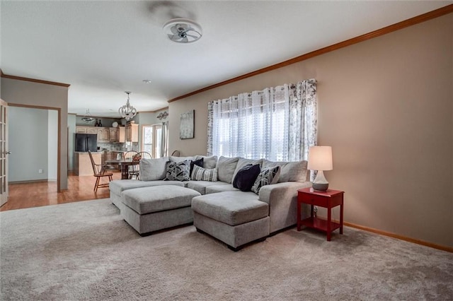 living room featuring carpet and crown molding