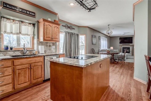 kitchen with a center island, tasteful backsplash, sink, stainless steel dishwasher, and black electric cooktop