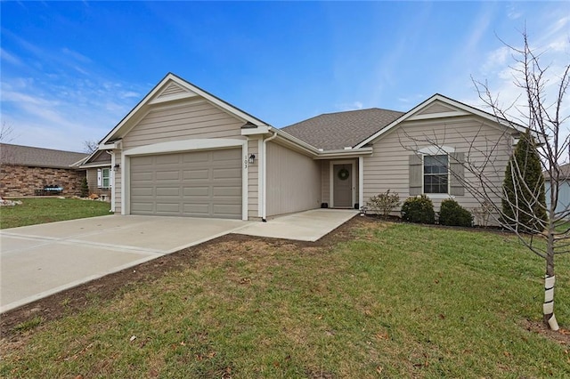 ranch-style home with a garage, roof with shingles, concrete driveway, and a front yard