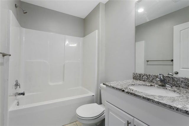 bathroom with bathing tub / shower combination, toilet, and vanity