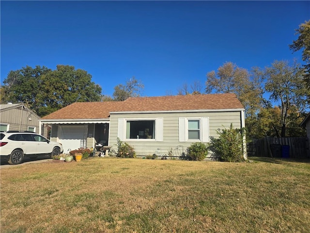 view of front of house with a garage and a front yard