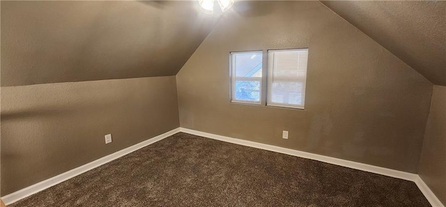 bonus room featuring carpet floors and vaulted ceiling