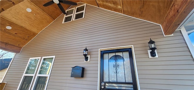 view of exterior entry with ceiling fan