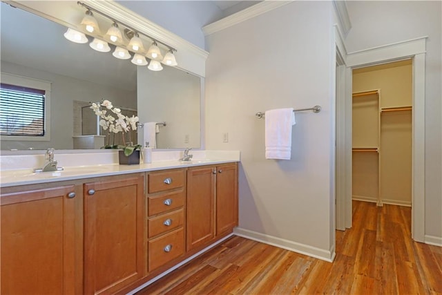 bathroom with vanity and hardwood / wood-style floors