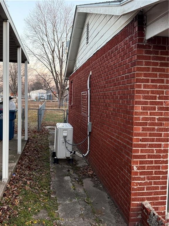 view of side of property featuring ac unit