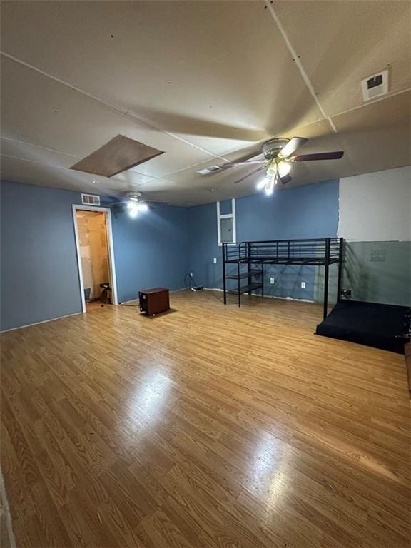 interior space with hardwood / wood-style flooring and ceiling fan