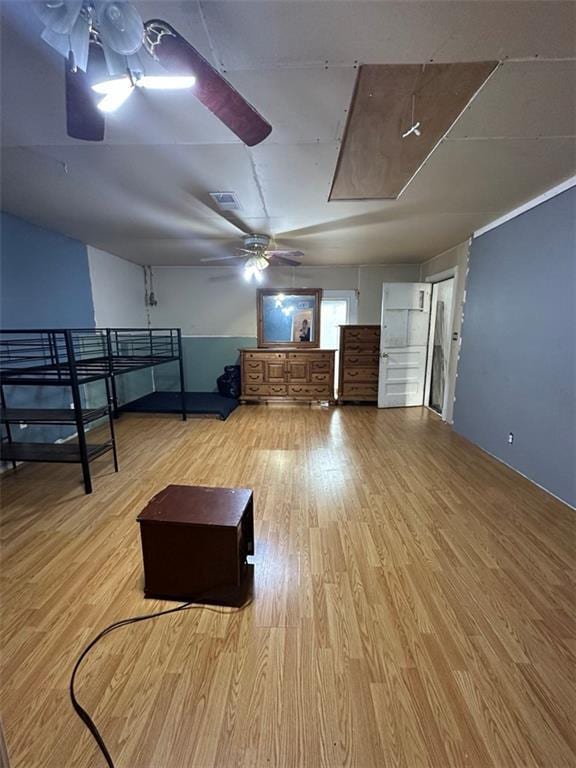 interior space featuring ceiling fan and light wood-type flooring