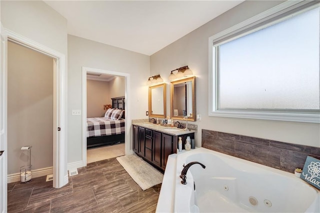 bathroom featuring a bath and vanity