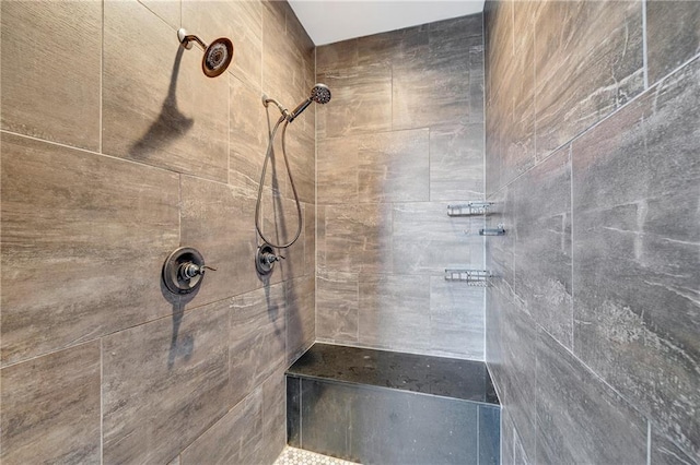 bathroom featuring tiled shower