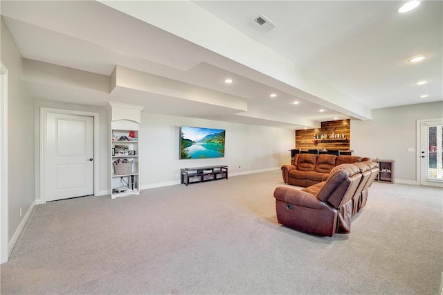 carpeted living room featuring bar