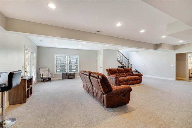 living room featuring light carpet