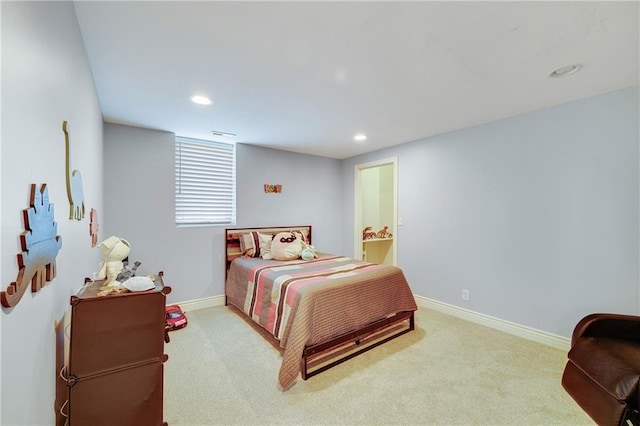 bedroom featuring carpet flooring and connected bathroom