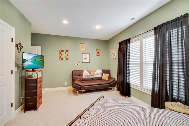 bedroom featuring light carpet