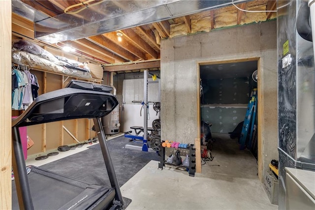 exercise room featuring water heater