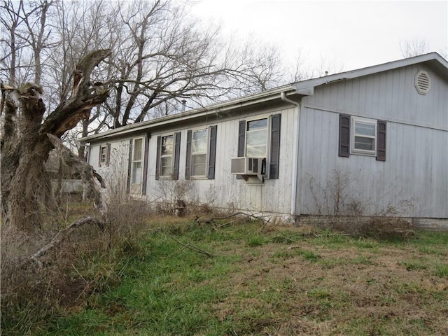 view of side of home featuring cooling unit