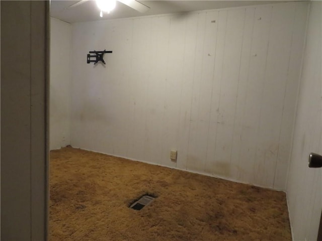 empty room with wood walls