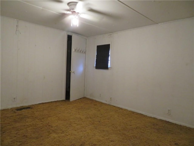 carpeted empty room with ceiling fan