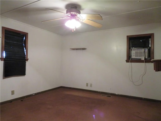 spare room with ceiling fan and cooling unit