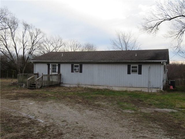 back of house featuring cooling unit