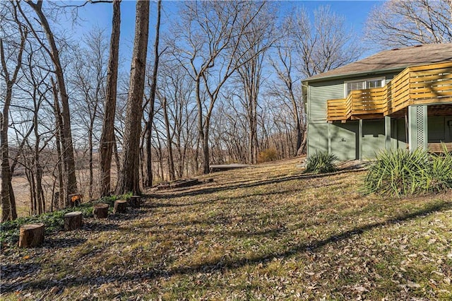 view of yard featuring a wooden deck