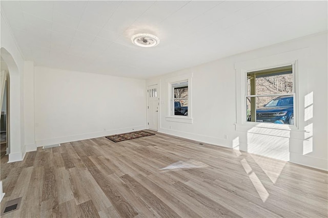 spare room with light hardwood / wood-style floors