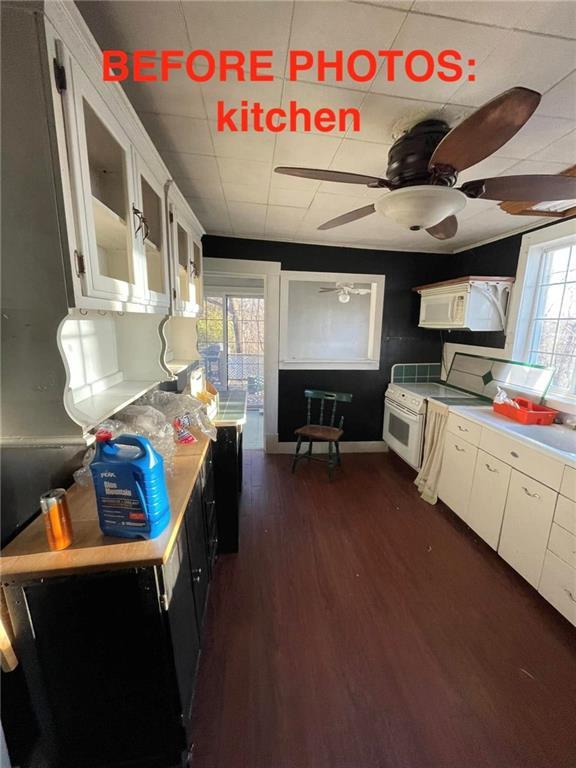 kitchen featuring white cabinetry and plenty of natural light