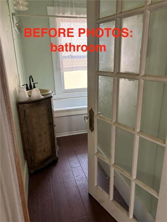 interior space with dark hardwood / wood-style floors and sink