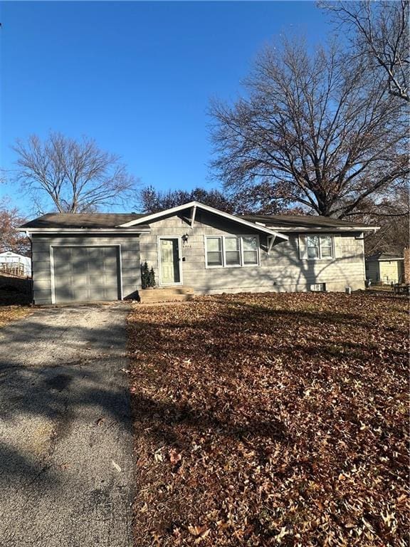 ranch-style home with a garage