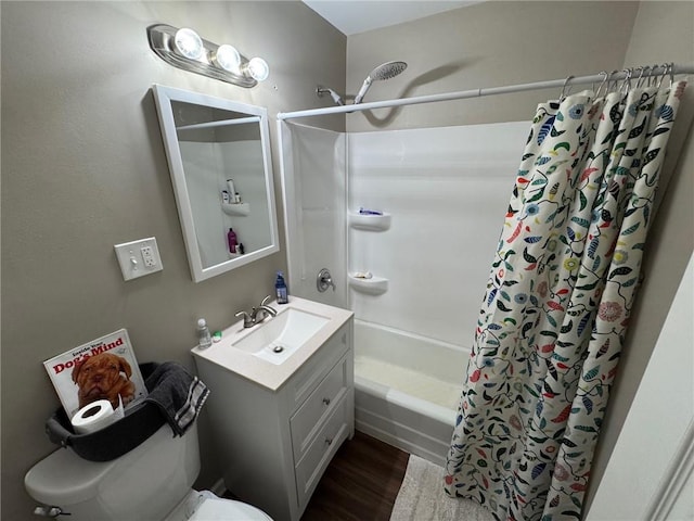 full bathroom featuring shower / tub combo with curtain, vanity, wood-type flooring, and toilet