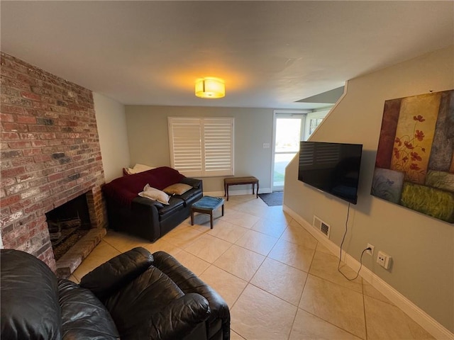 tiled living room featuring a fireplace