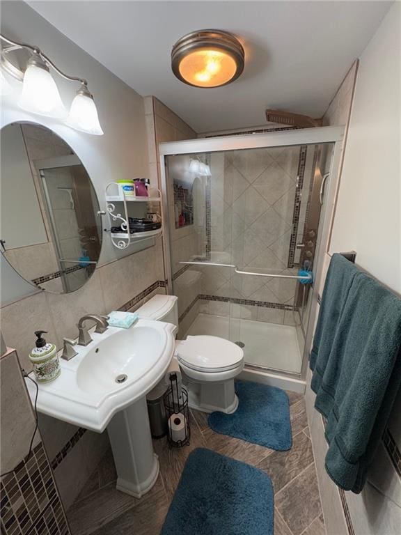 bathroom featuring tasteful backsplash, toilet, and walk in shower