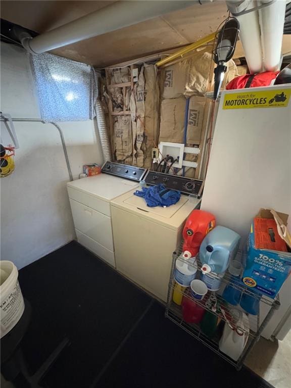 clothes washing area with washer and dryer