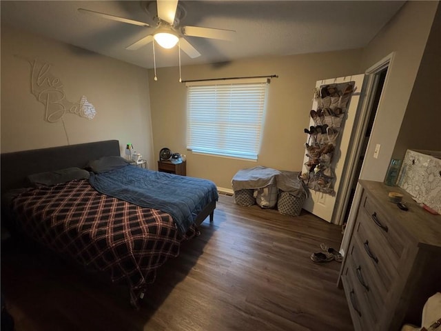 bedroom featuring dark wood-type flooring and ceiling fan