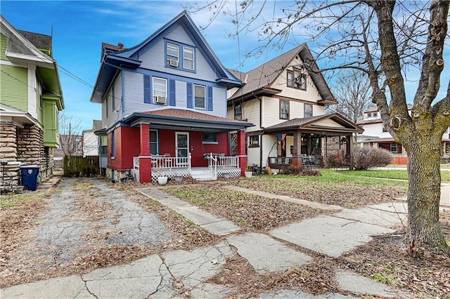 view of front of property featuring covered porch and cooling unit