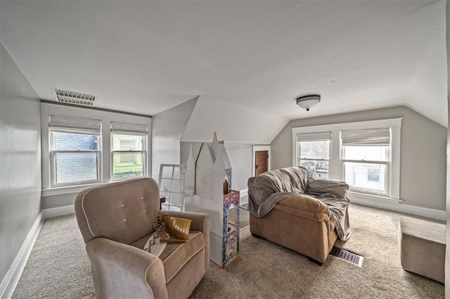 interior space featuring carpet flooring and a healthy amount of sunlight