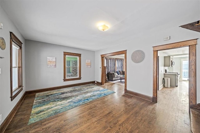 corridor featuring dark hardwood / wood-style floors